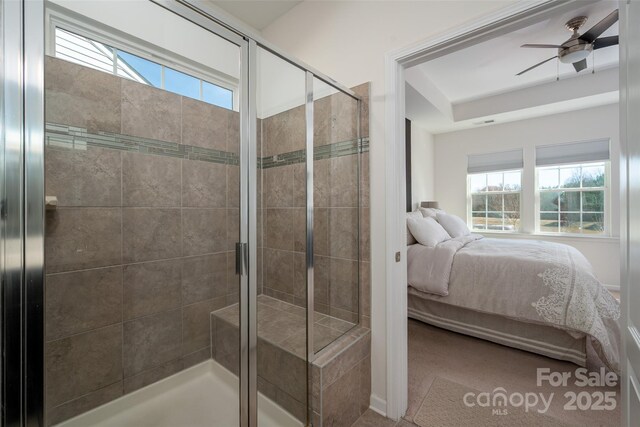 bathroom with ceiling fan and walk in shower