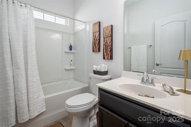 full bathroom featuring toilet, vanity, and shower / bathtub combination with curtain