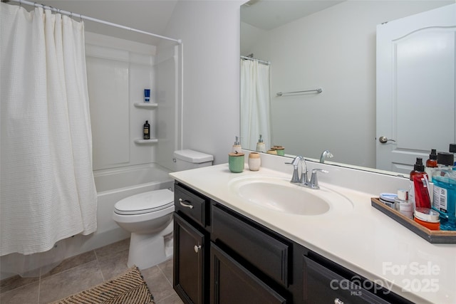 full bathroom with vanity, toilet, tile patterned flooring, and shower / tub combo