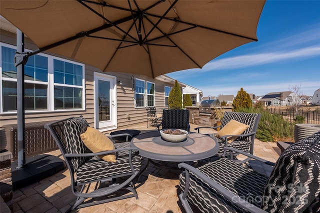 view of patio / terrace with area for grilling and central air condition unit