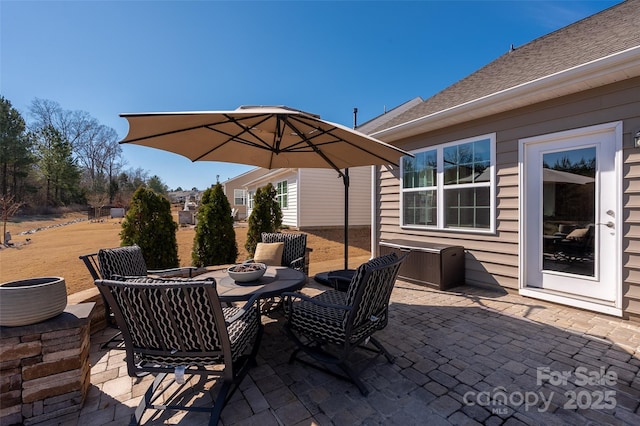 view of patio featuring a fire pit