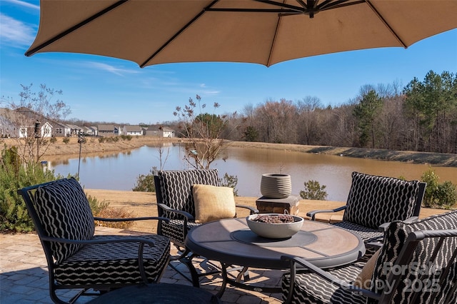 view of patio / terrace featuring a water view