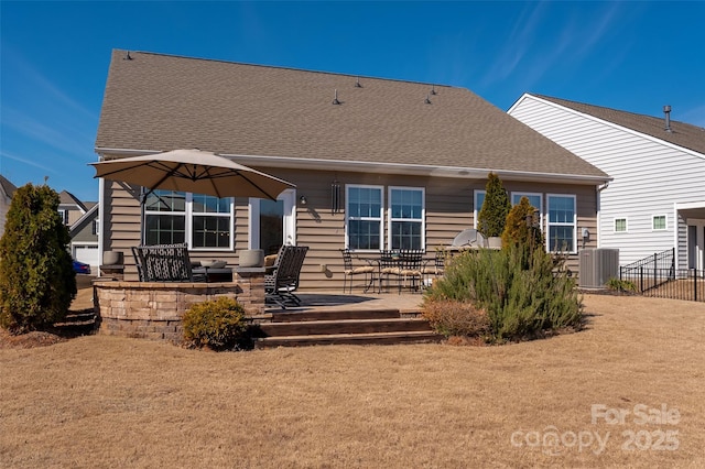 back of property with central AC