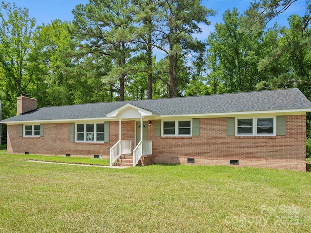 single story home featuring a front lawn