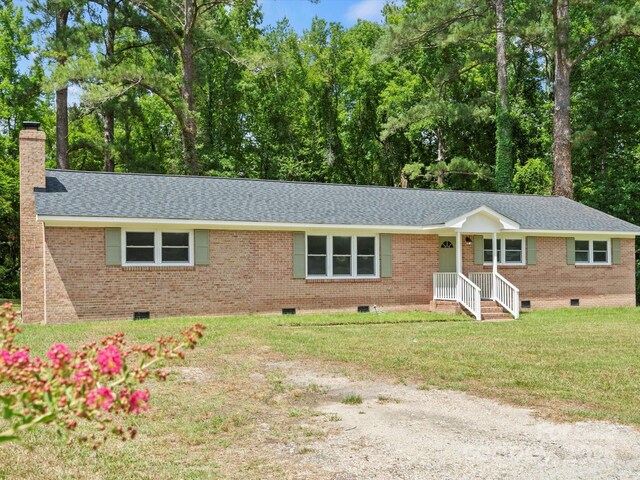 single story home with a front yard