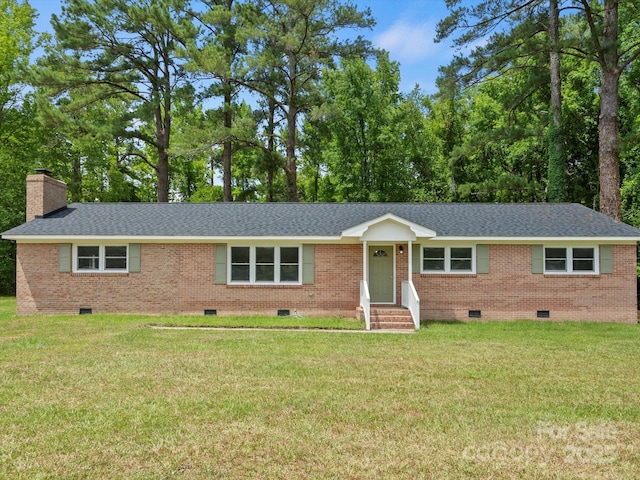 ranch-style house with a front yard