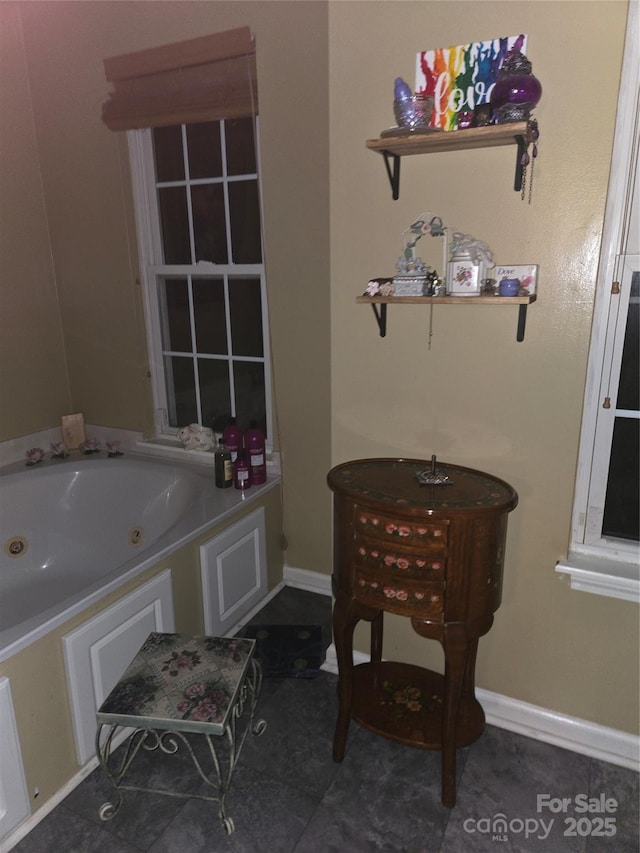 bathroom featuring a tub to relax in