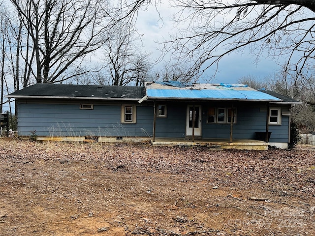 view of front of house featuring crawl space and a patio area