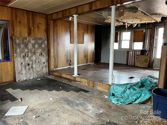 empty room featuring wooden walls