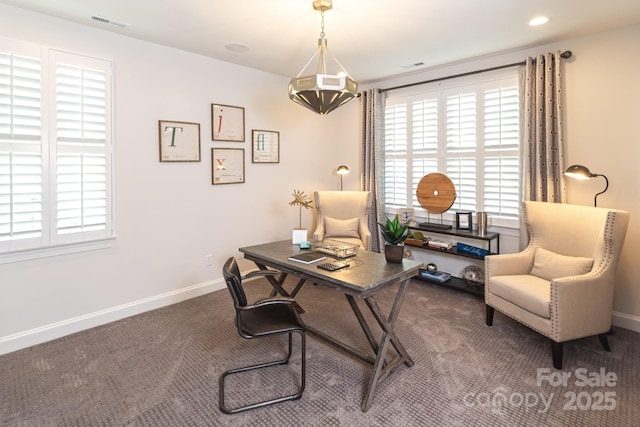 office space with dark carpet and a wealth of natural light