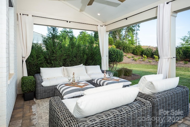 sunroom with vaulted ceiling and ceiling fan