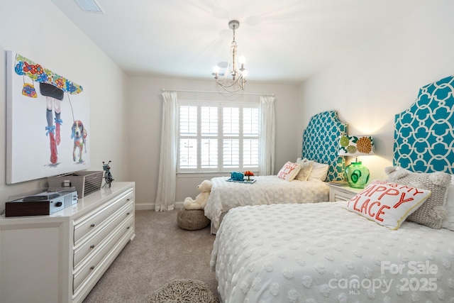 bedroom with an inviting chandelier and light colored carpet