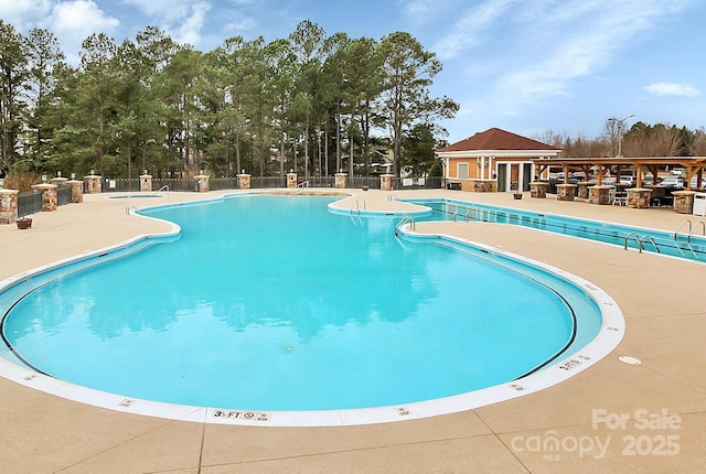 view of swimming pool featuring a patio