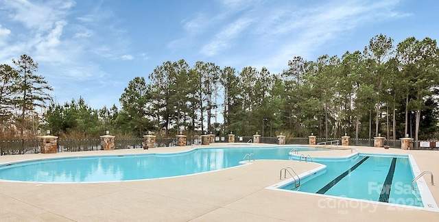 view of pool featuring a patio area