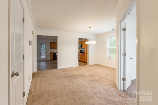 empty room with crown molding, light carpet, and a notable chandelier