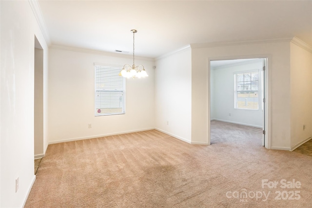 empty room with crown molding and light carpet