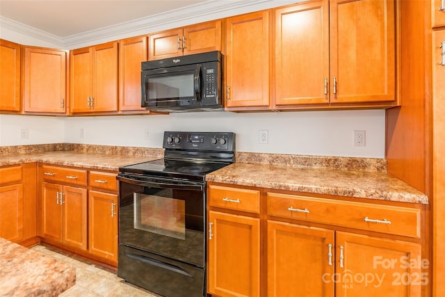 kitchen with light stone countertops, crown molding, and black appliances