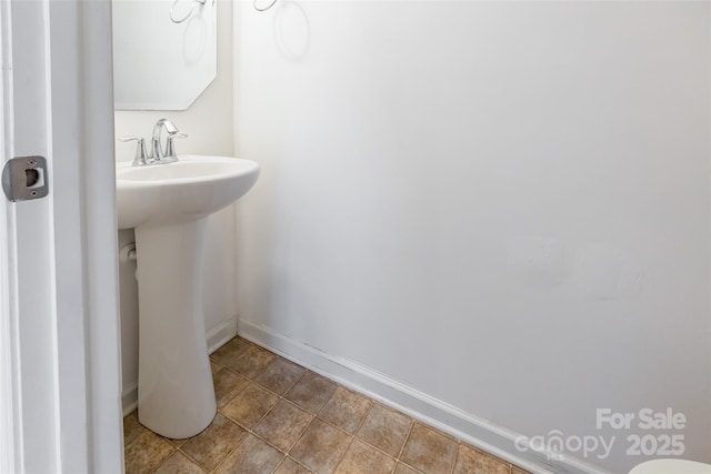 bathroom with tile patterned floors