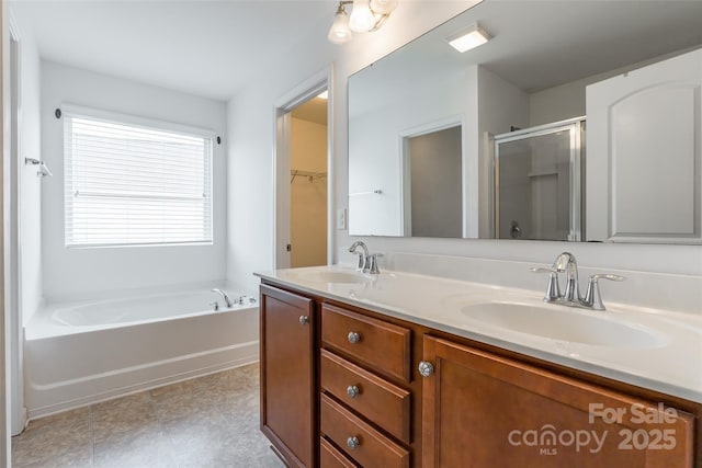 bathroom with shower with separate bathtub and vanity