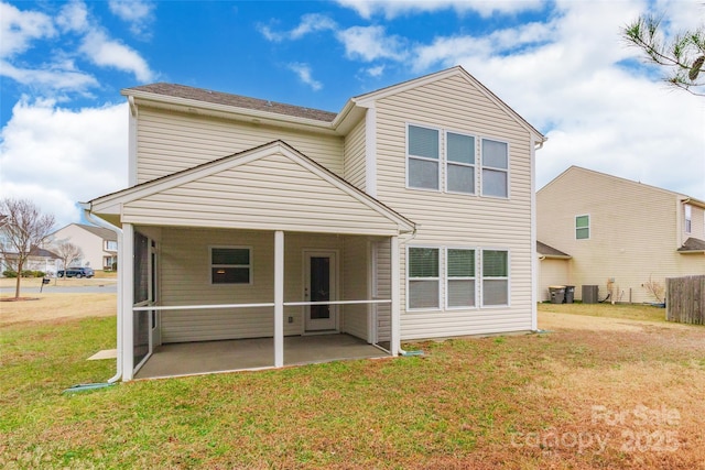 back of property featuring a patio, a yard, and cooling unit