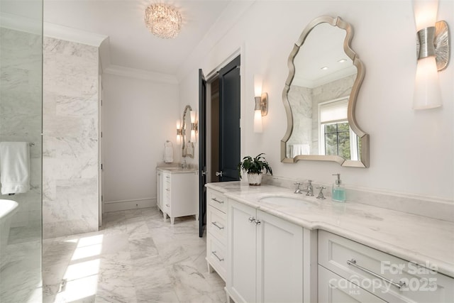 bathroom with baseboards, marble finish floor, vanity, and crown molding