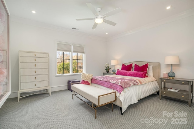 bedroom with ornamental molding, visible vents, and carpet flooring