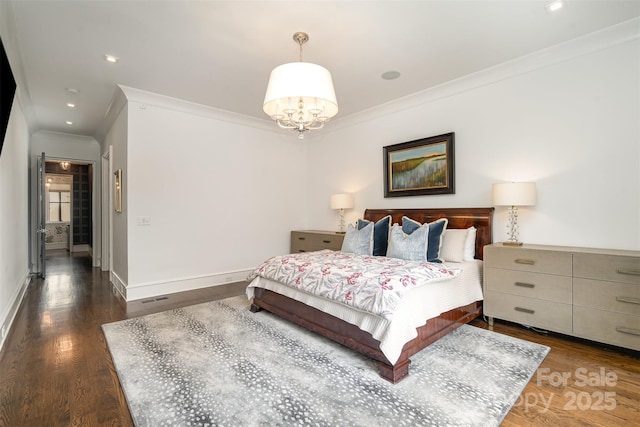 1328 S Kings Dr, Charlotte, NC 28207 - bedroom with ornamental molding, wood finished floors, baseboards, and a chandelier