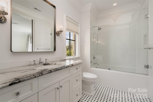 1328 S Kings Dr, Charlotte, NC 28207 - full bath with tiled shower / bath, toilet, vanity, tile patterned flooring, and recessed lighting