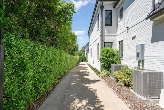 1328 S Kings Dr, Charlotte, NC 28207 - view of side of home featuring central AC