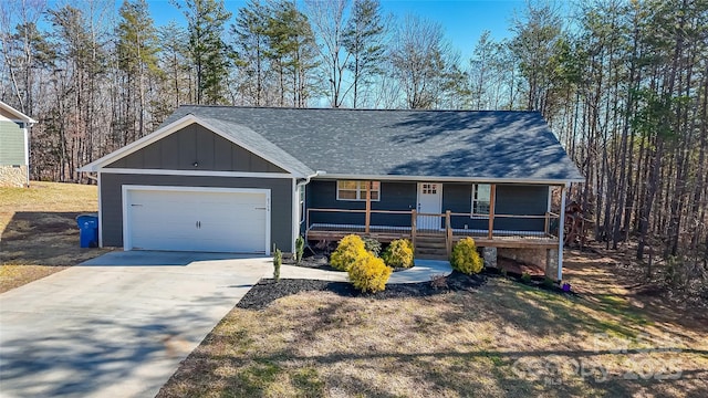 single story home featuring a garage and a porch