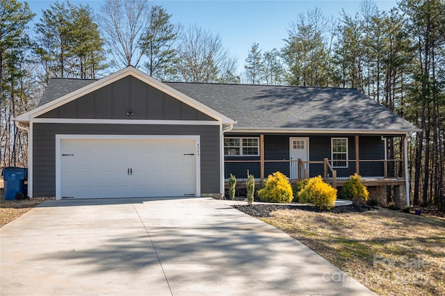 single story home with a garage and covered porch