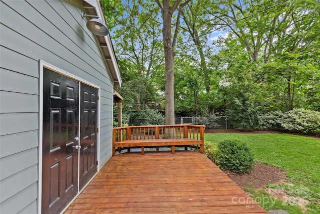 deck featuring a lawn