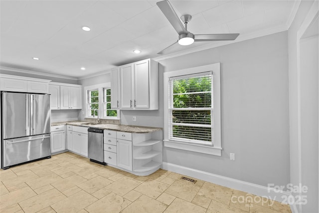 kitchen featuring stainless steel appliances, white cabinetry, ornamental molding, and ceiling fan