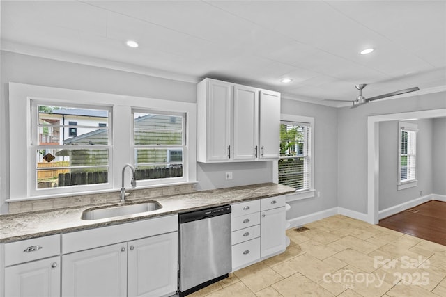 kitchen with sink, ceiling fan, ornamental molding, white cabinets, and stainless steel dishwasher