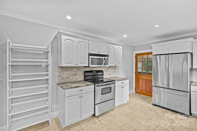 kitchen featuring white cabinetry, decorative backsplash, ornamental molding, stainless steel appliances, and light stone countertops