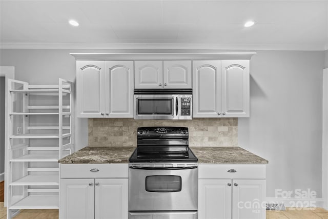 kitchen with white cabinetry, crown molding, tasteful backsplash, and appliances with stainless steel finishes