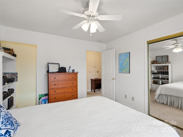 1206 Deermouse Way, Hendersonville, NC 28792 - carpeted bedroom featuring a textured ceiling, a closet, and ceiling fan