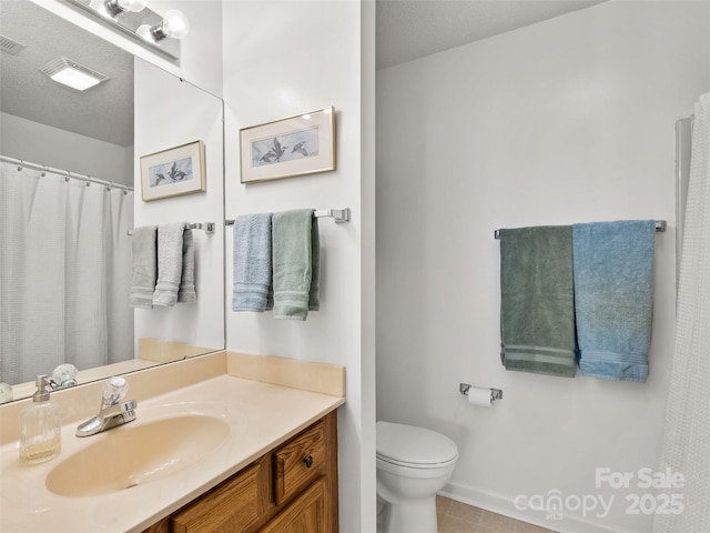 1206 Deermouse Way, Hendersonville, NC 28792 - bathroom with vanity, tile patterned flooring, a textured ceiling, and toilet