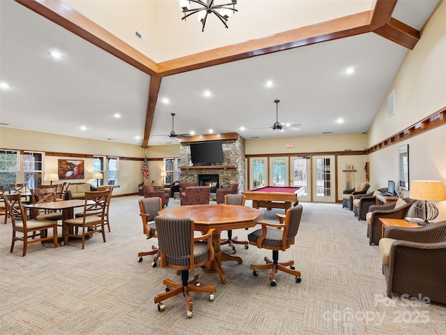 1206 Deermouse Way, Hendersonville, NC 28792 - carpeted dining space featuring ceiling fan, high vaulted ceiling, a fireplace, and beam ceiling