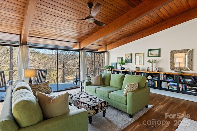 sunroom / solarium with ceiling fan, lofted ceiling with beams, and wooden ceiling