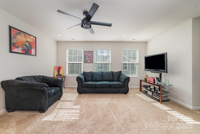 living room featuring light carpet and ceiling fan