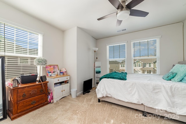 carpeted bedroom featuring ceiling fan