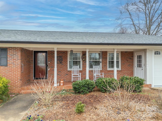 doorway to property with covered porch