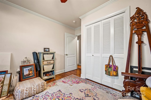 interior space with hardwood / wood-style flooring and crown molding