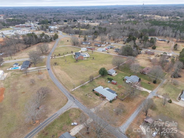 birds eye view of property featuring a rural view