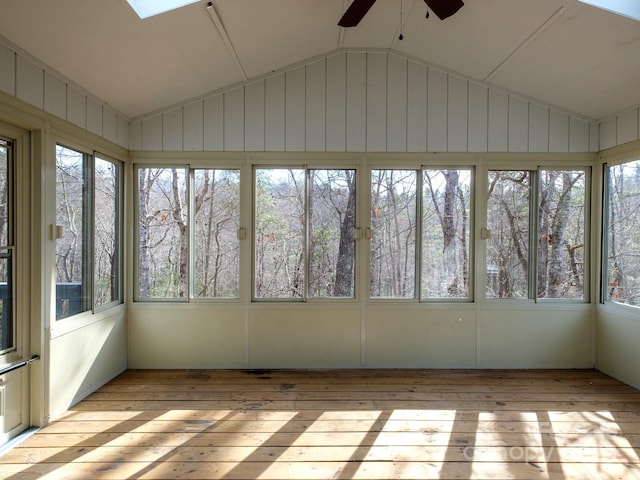 unfurnished sunroom with ceiling fan and vaulted ceiling