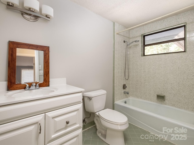 full bath with a textured ceiling, toilet, vanity, shower / washtub combination, and tile patterned floors