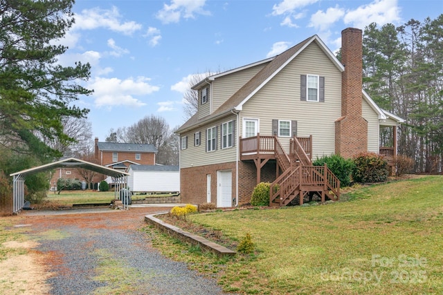 view of front of property featuring a carport, a garage, a front yard, and a deck