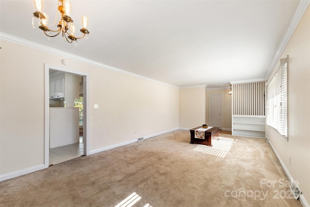 unfurnished living room featuring ornamental molding, light carpet, and an inviting chandelier