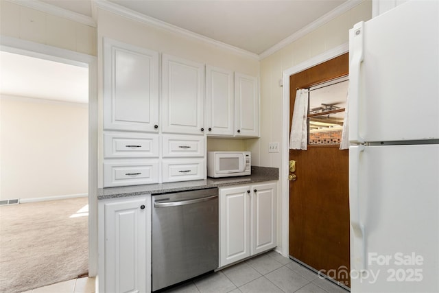 kitchen with crown molding, light carpet, white cabinets, and white appliances